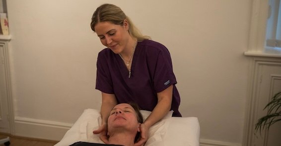 Amy O'Halloran using a hands-on osteopathic technique