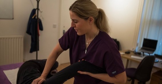 Amy O'Halloran treating a patient's leg at Silsden Osteopathy
